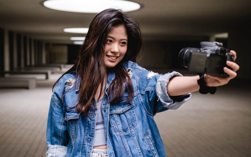 asian-woman-vlogging-and-using-camera-social-media-influencer-content-creator-lifestyle-1.jpg