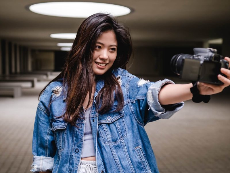 asian-woman-vlogging-and-using-camera-social-media-influencer-content-creator-lifestyle-1.jpg